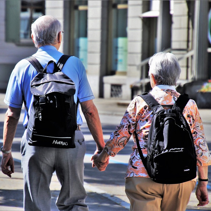 Stock image of an Elderly couple holding hands